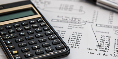 Calculator beside finance documents